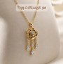 A gold pendant necklace with a rose-shaped centerpiece and three dangling teardrop charms, displayed on a cream-colored jewelry bust. Arabic text is overlaid at the top.